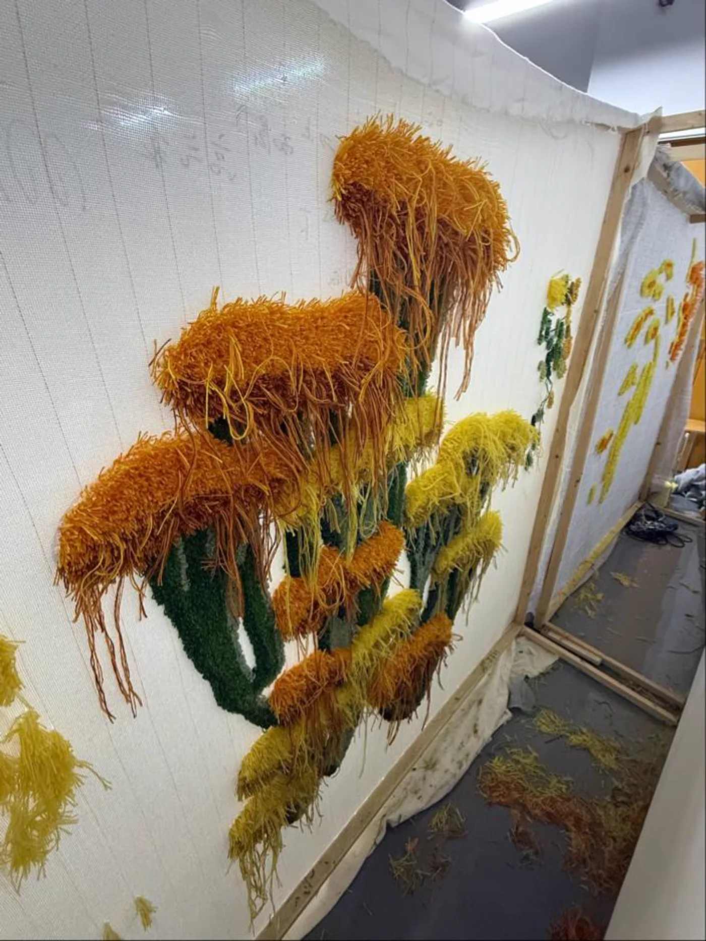 Tufting process on a stretched frame