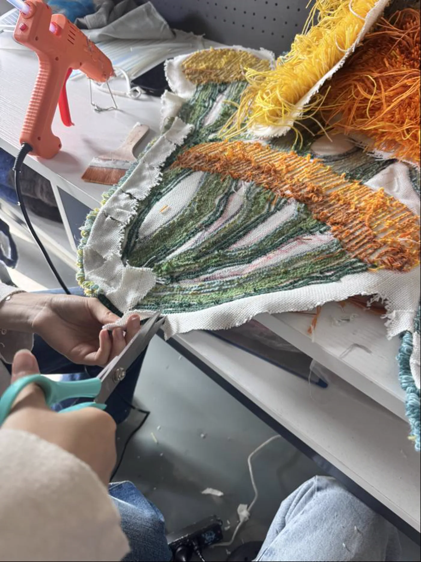 Trimming the raised tufted surface