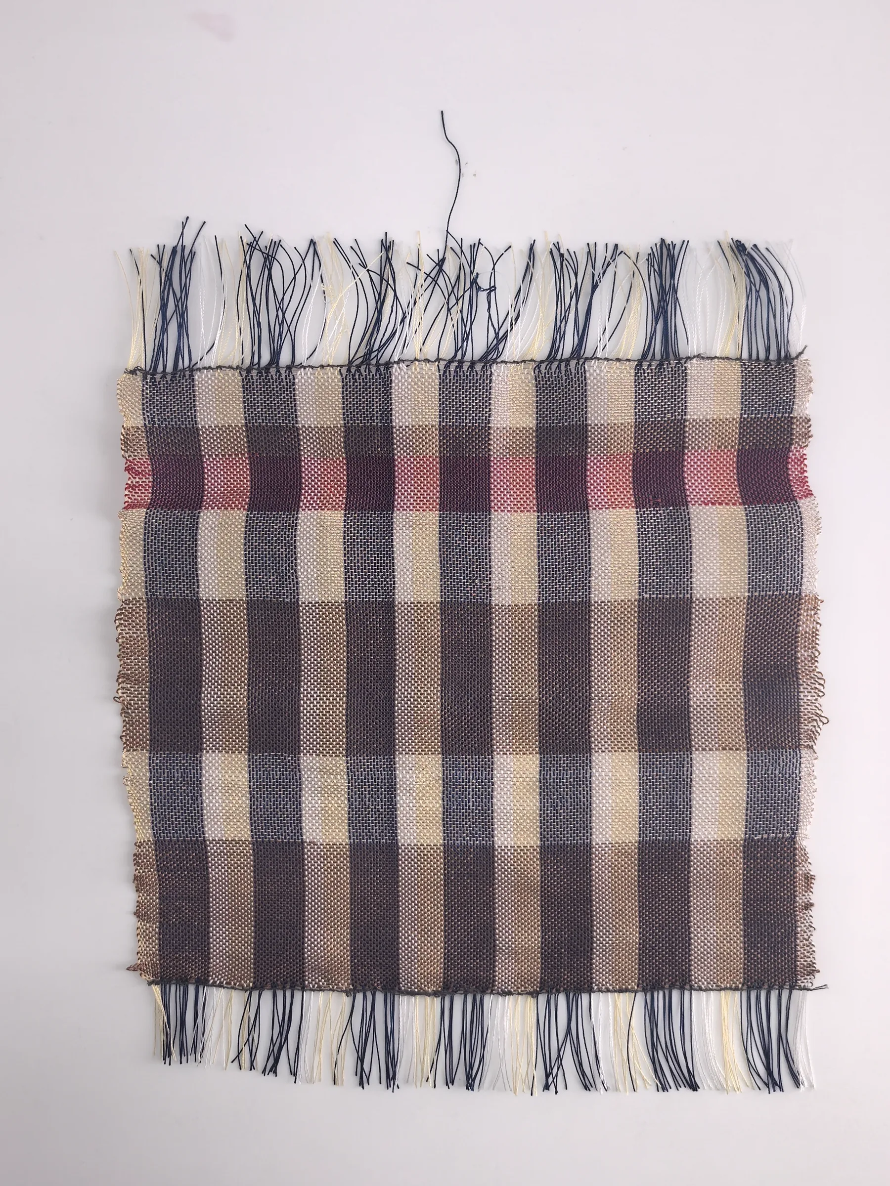 Brown, cream and purple plaid handwoven sample