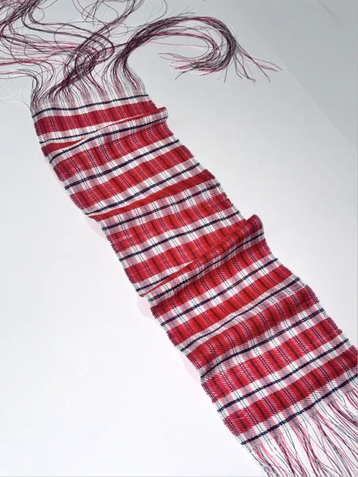 Red plaid handwoven sample with raised folds